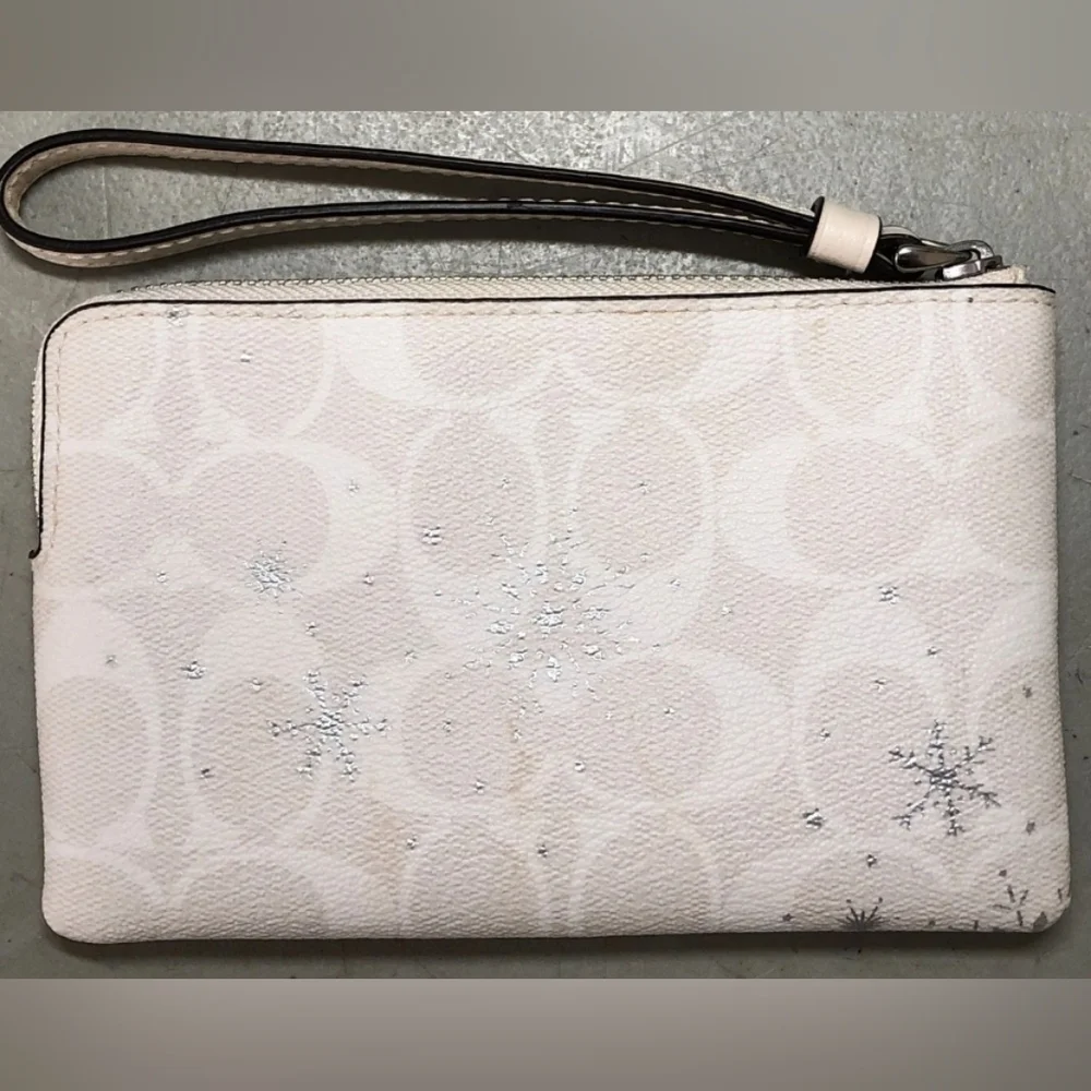Coach Snowflakes white Wristlet.
